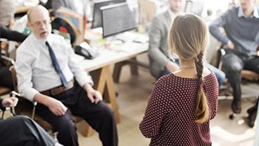 woman talking to group