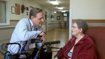 Loch Haven administrator Byron Freeman, left, visits with resident Phyllis McDowell. University of Missouri Extension