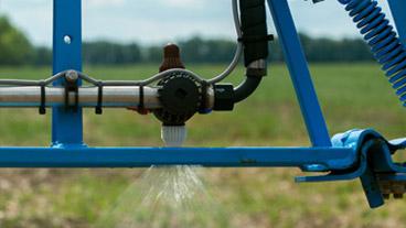 nutrients being sprayed on a field